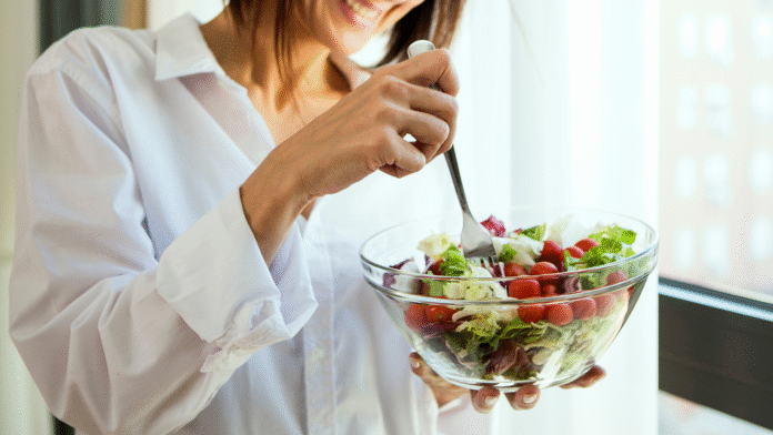 Woman eating salad