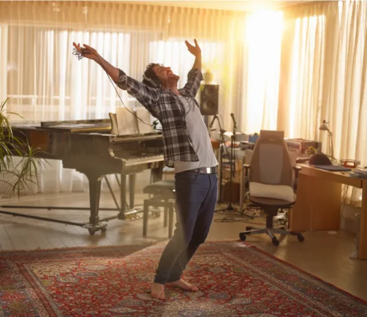 Habits That Boost Happiness: What Science Says About Feeling Better A happy man dancing in living room