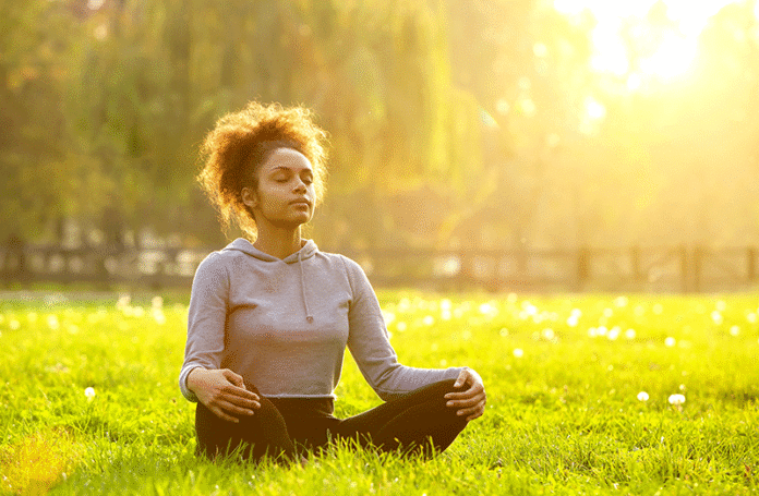 meditation Woman meditating on grass
